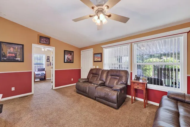 a view of a backyard with sitting area