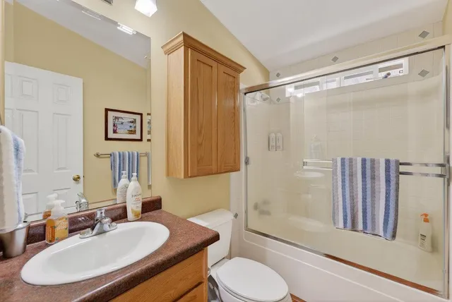 a view of a road with a tree in the background