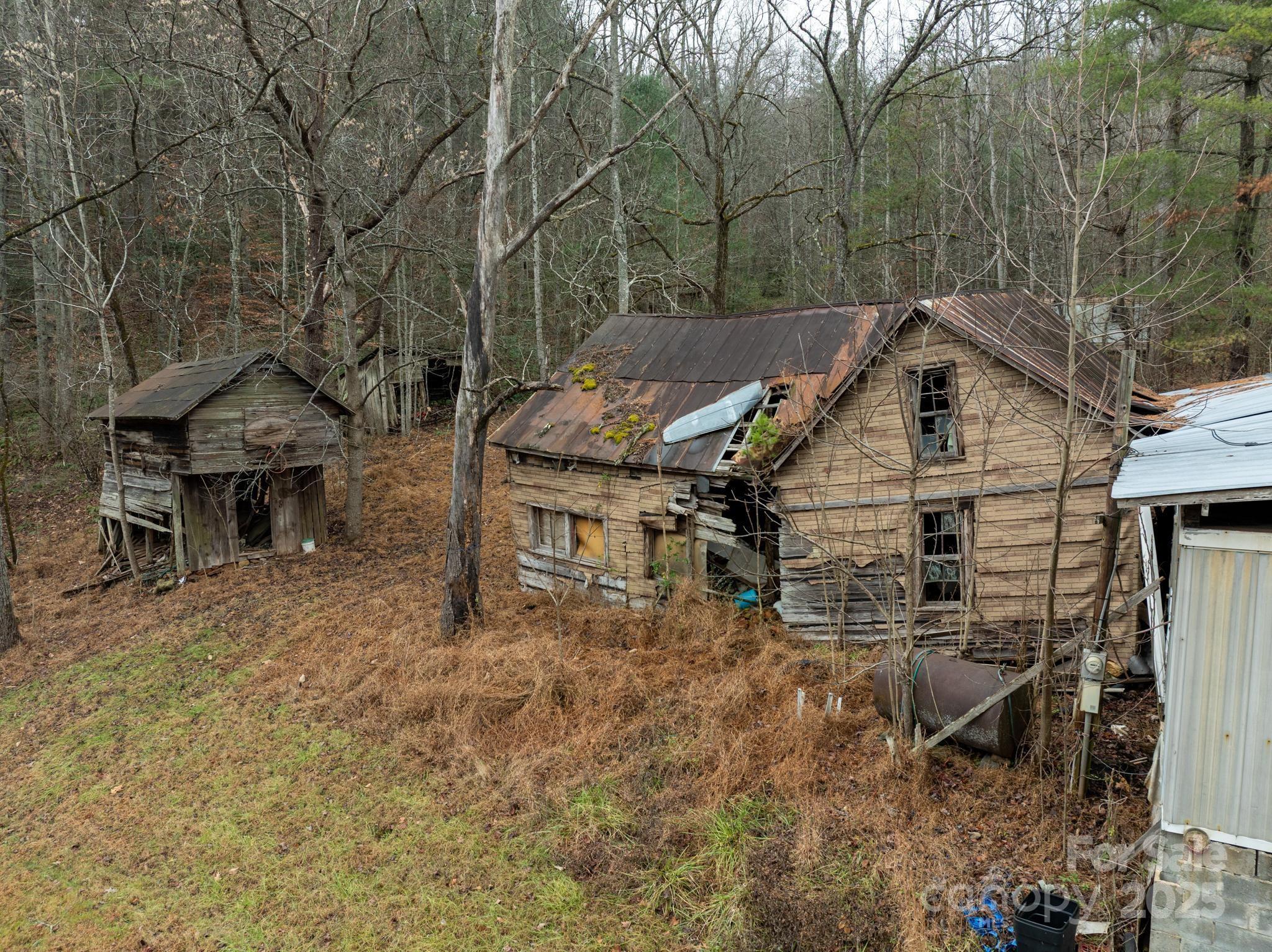 1864 Starcross Road Lenoir, NC 28645 - Photo 15 of 17 a view of a house with a yard and sitting area