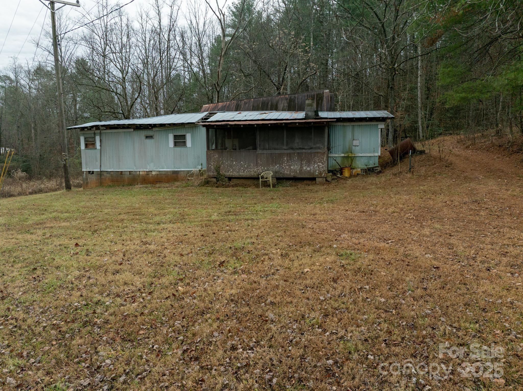 1864 Starcross Road Lenoir, NC 28645 - Photo 16 of 17 front view of a house with a yard