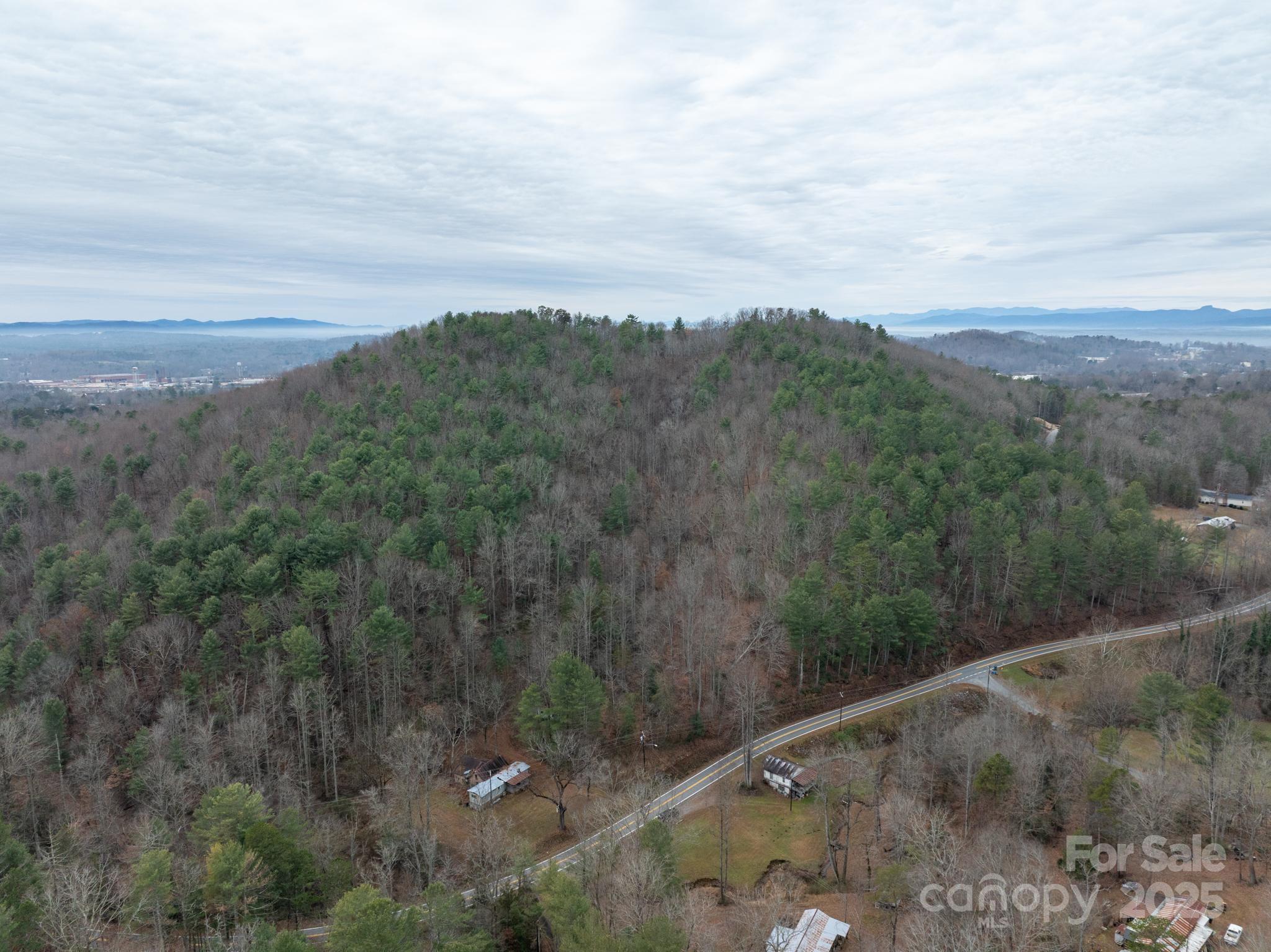 1864 Starcross Road Lenoir, NC 28645 - Photo 6 of 17 a view of a city with lush green forest