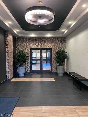 a view of an entryway with a flower pot and a fireplace