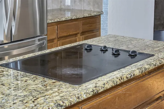 an empty room with closet and windows