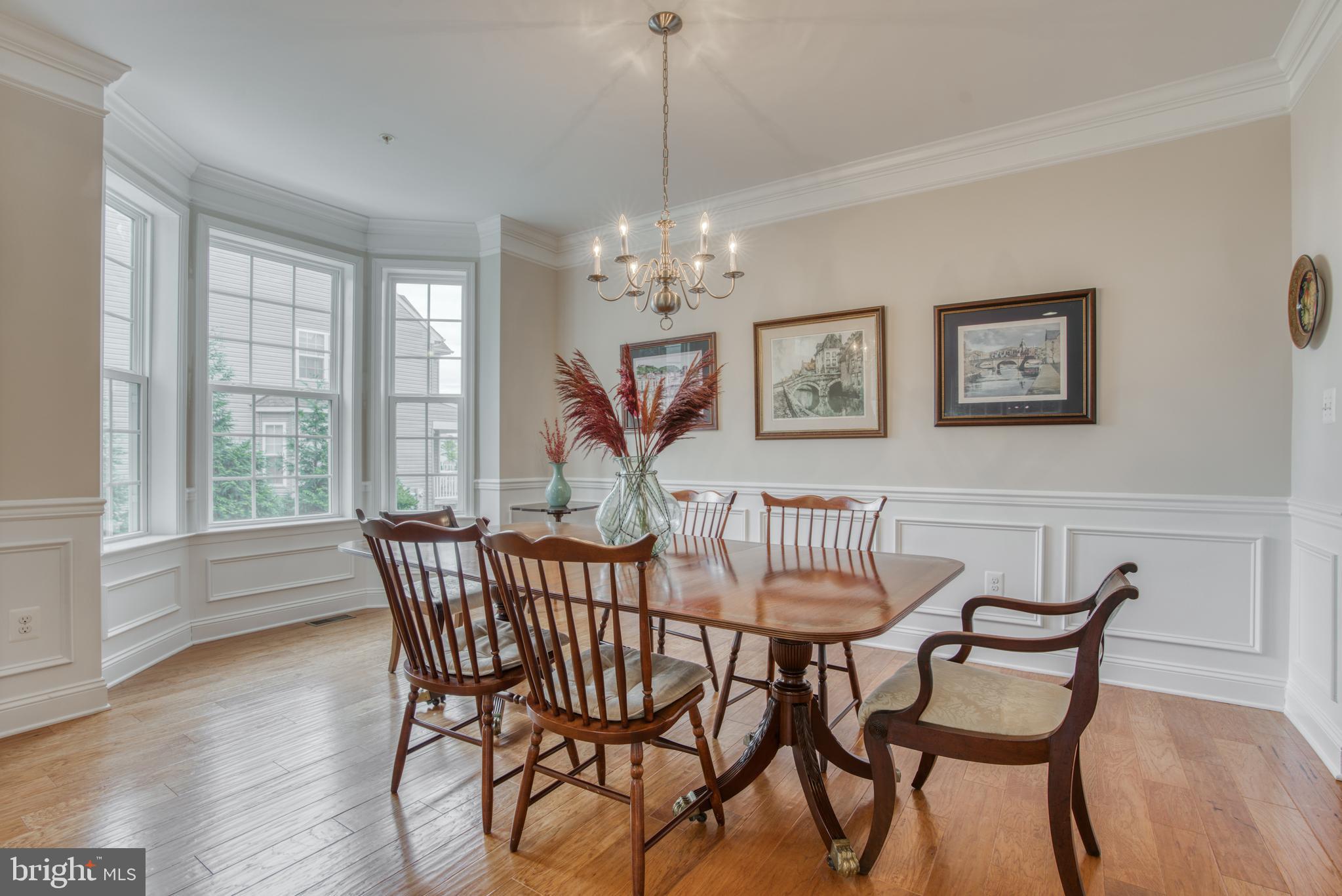 2344 Sweet Meadow Road Baltimore, MD 21209 - Photo 13 of 76 a view of a dining room with furniture window and wooden floor