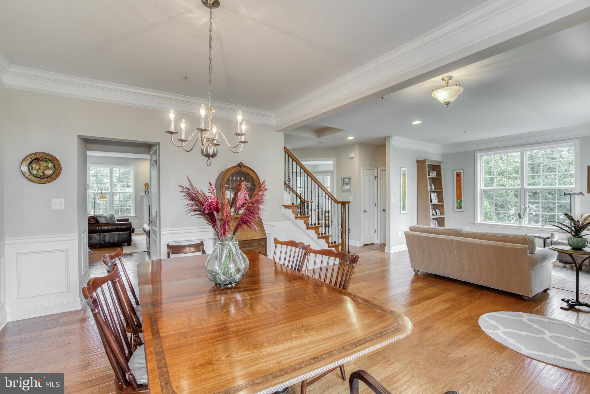 2344 Sweet Meadow Road Baltimore, MD 21209 - Photo 14 of 76 a living room with fireplace furniture and a chandelier