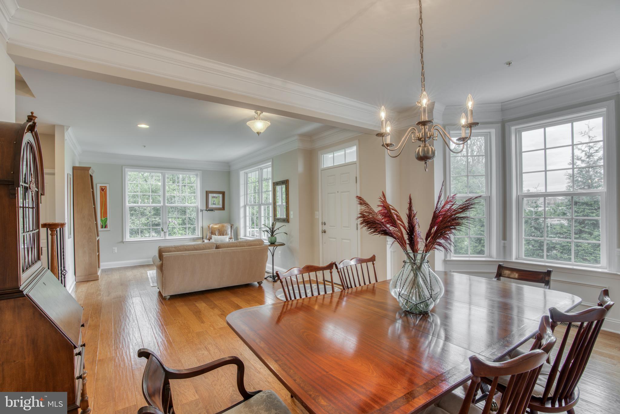 2344 Sweet Meadow Road Baltimore, MD 21209 - Photo 15 of 76 a dining room with furniture a livingroom view and wooden floor