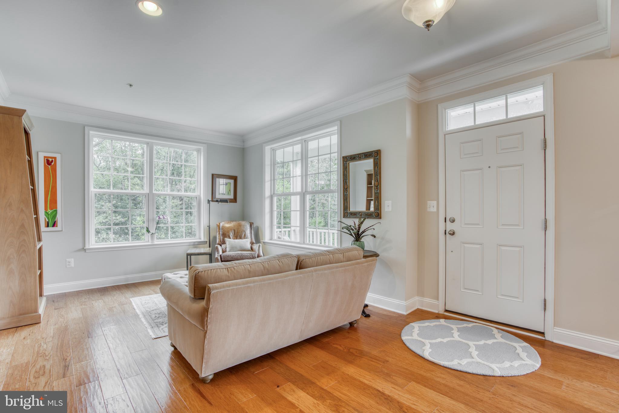 2344 Sweet Meadow Road Baltimore, MD 21209 - Photo 17 of 76 a living room with furniture and a large window