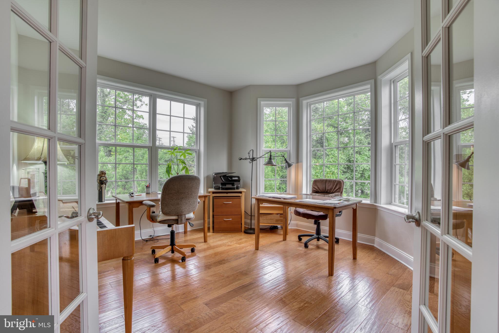 2344 Sweet Meadow Road Baltimore, MD 21209 - Photo 37 of 76 a view of a livingroom with workspace and a large window