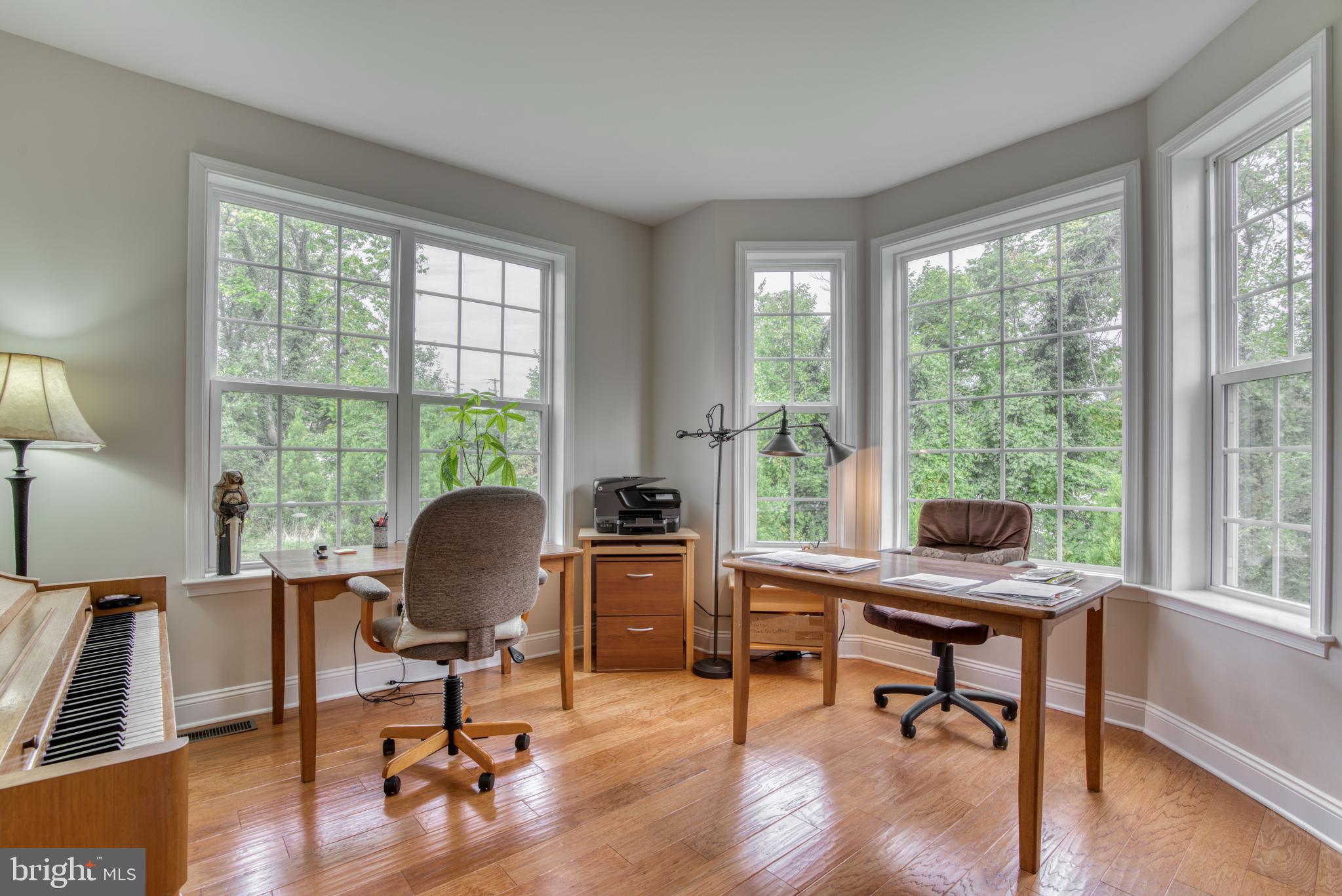 2344 Sweet Meadow Road Baltimore, MD 21209 - Photo 38 of 76 a view of a workspace with furniture and a window