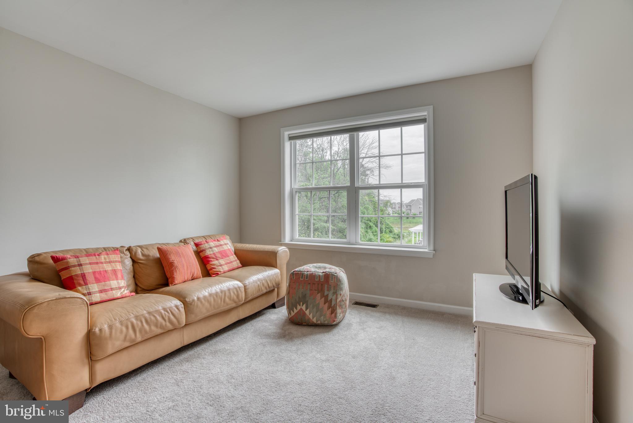 2344 Sweet Meadow Road Baltimore, MD 21209 - Photo 44 of 76 a living room with furniture and a window
