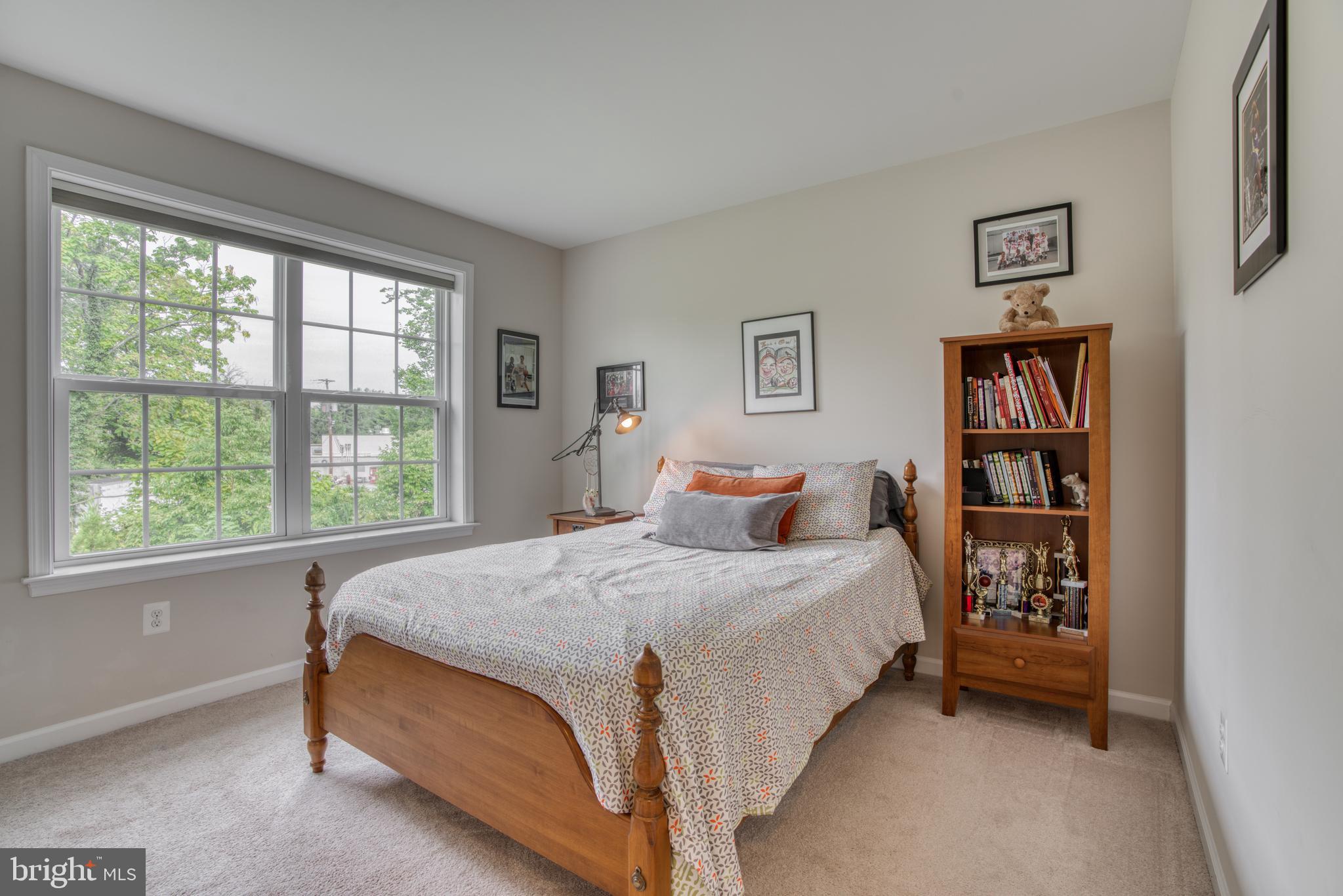 2344 Sweet Meadow Road Baltimore, MD 21209 - Photo 46 of 76 a bedroom with a bed and a large window