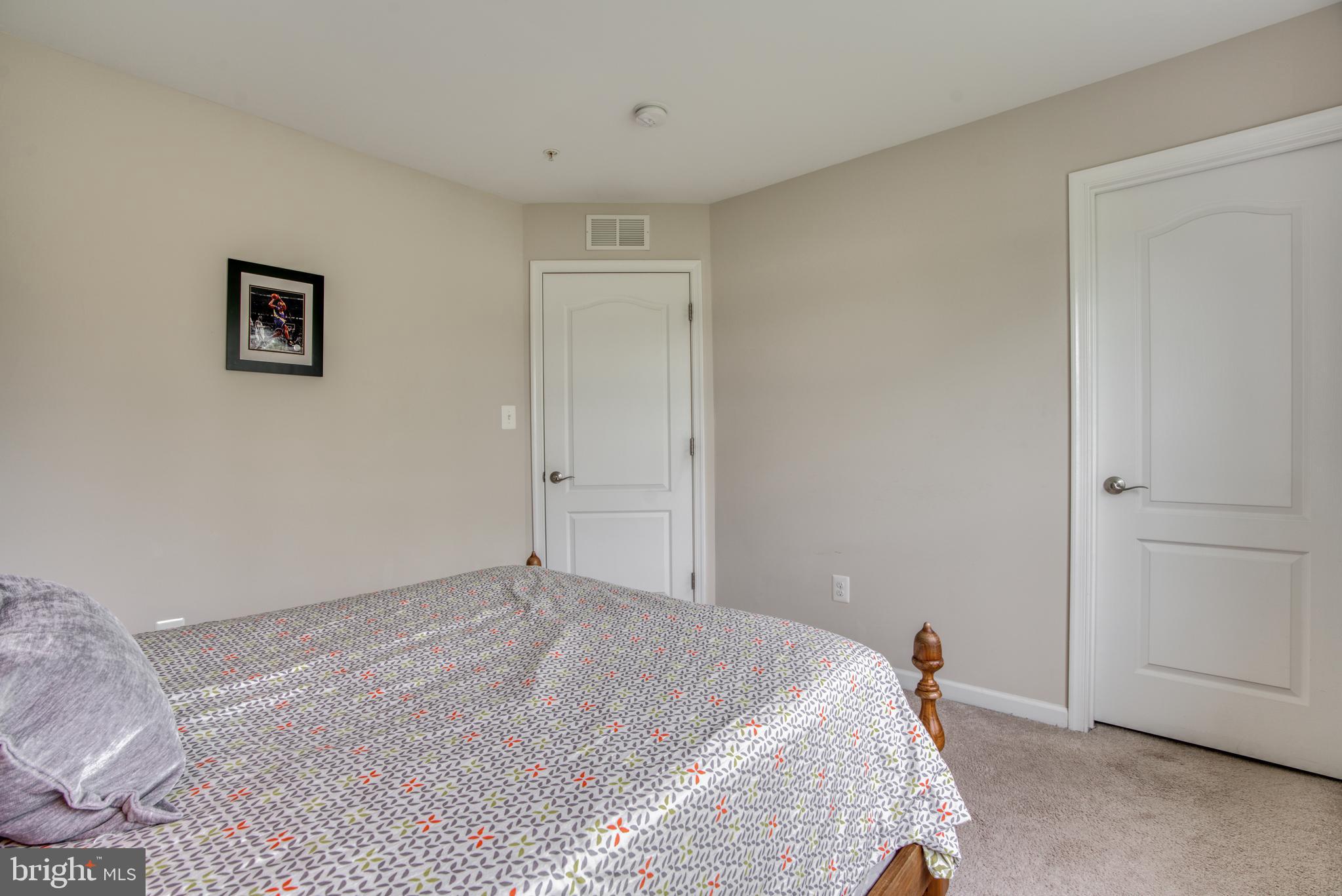 2344 Sweet Meadow Road Baltimore, MD 21209 - Photo 47 of 76 a bedroom with a bed and a painting on the wall