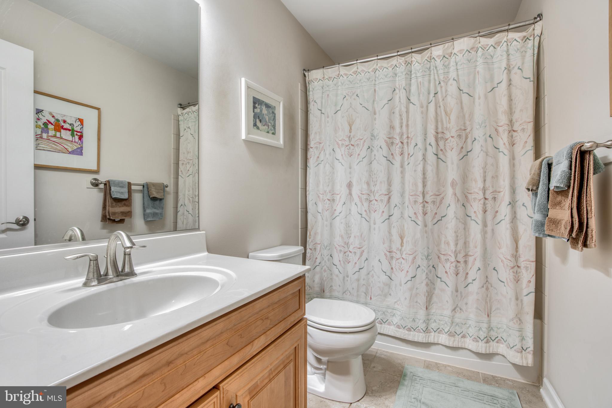 2344 Sweet Meadow Road Baltimore, MD 21209 - Photo 48 of 76 a bathroom with a granite countertop sink and a mirror