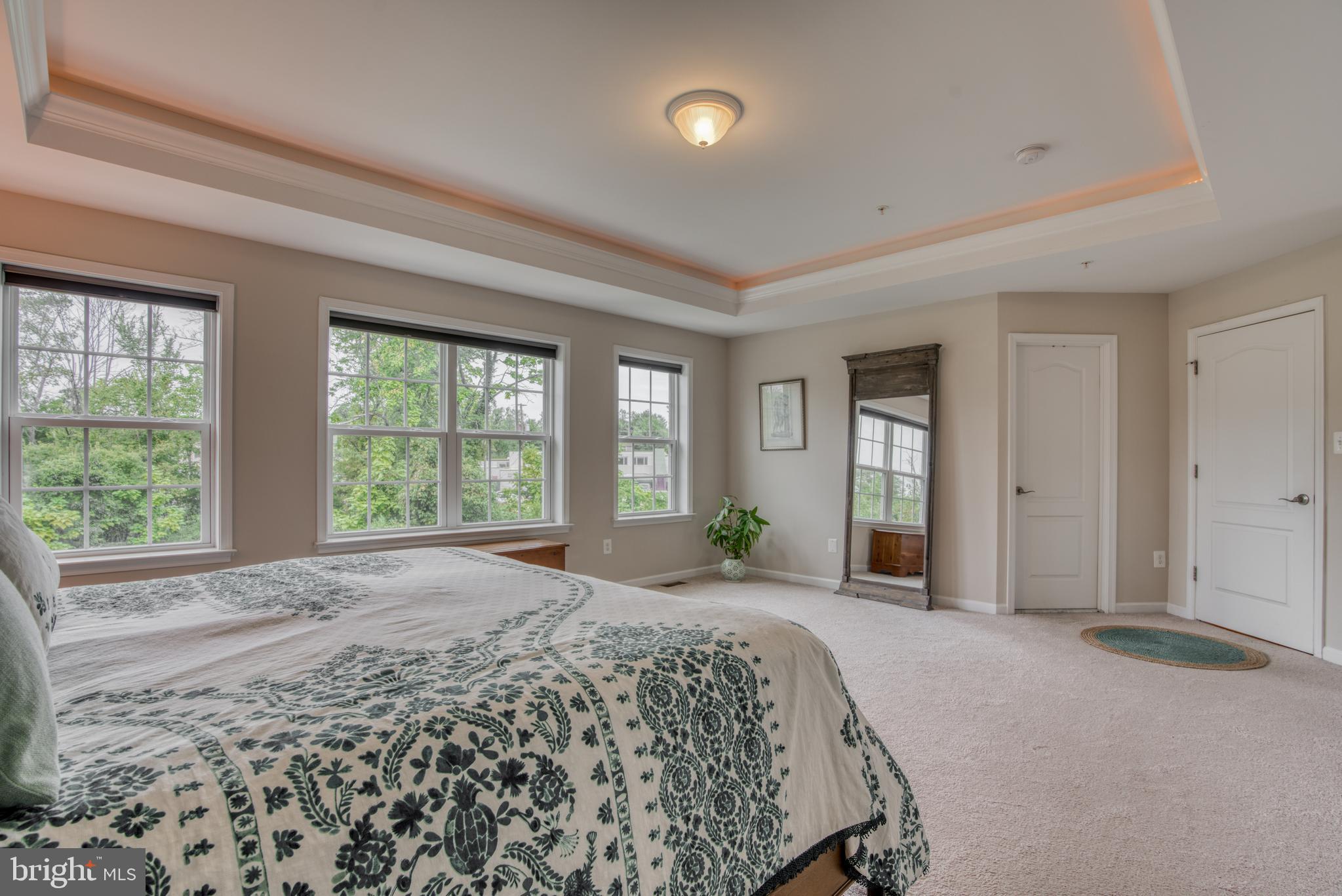 2344 Sweet Meadow Road Baltimore, MD 21209 - Photo 58 of 76 a spacious bedroom with a large bed and a large window