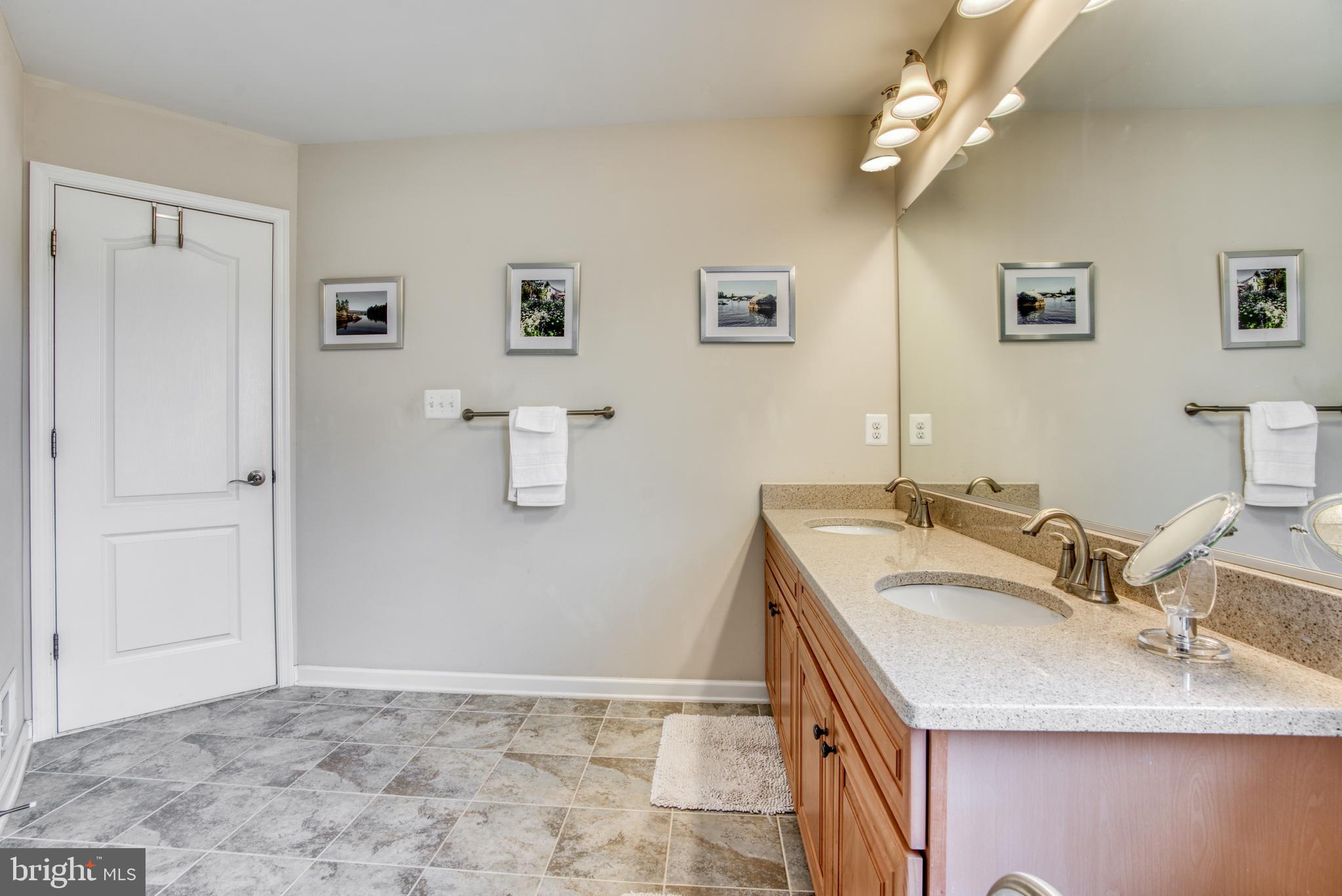 2344 Sweet Meadow Road Baltimore, MD 21209 - Photo 64 of 76 a bathroom with a sink and a mirror
