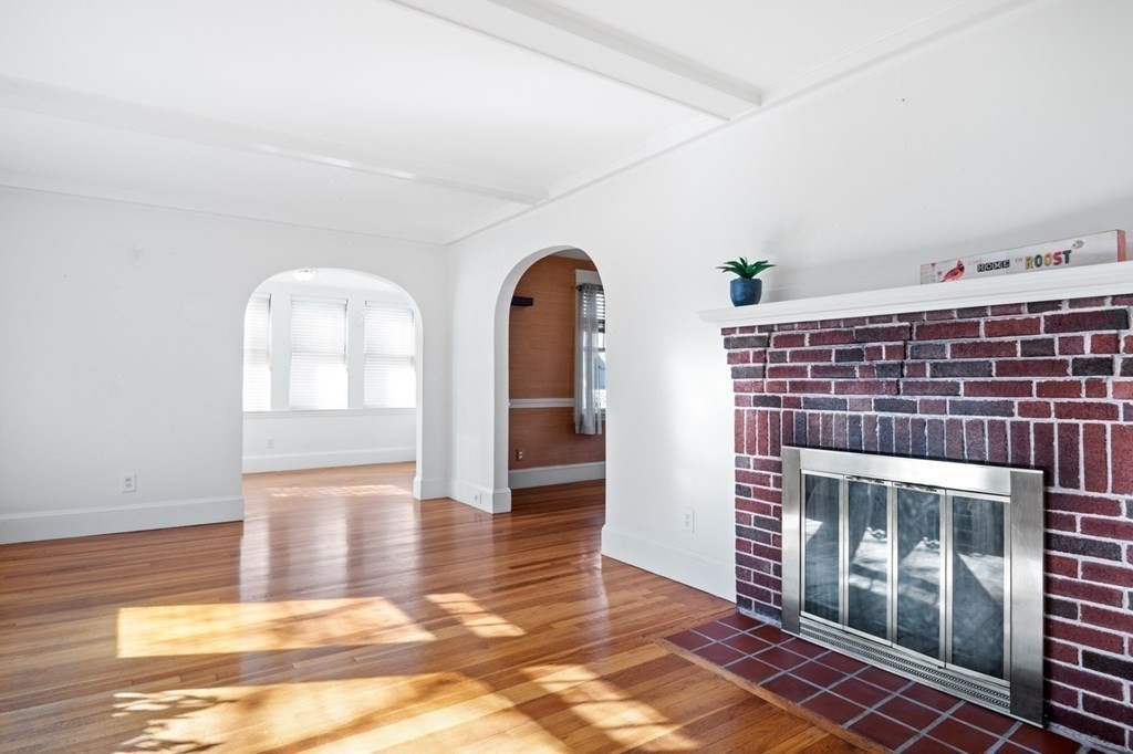 6 Stone Street Saugus, MA 01906 - Photo 11 of 39 a view of empty room with wooden floor and fan