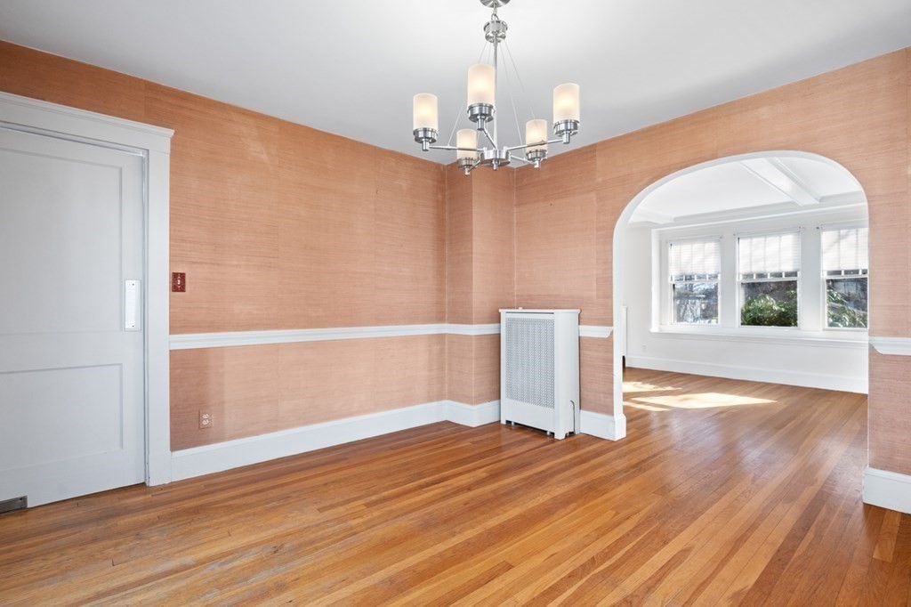 6 Stone Street Saugus, MA 01906 - Photo 16 of 39 a view of a room with wooden floor and large windows