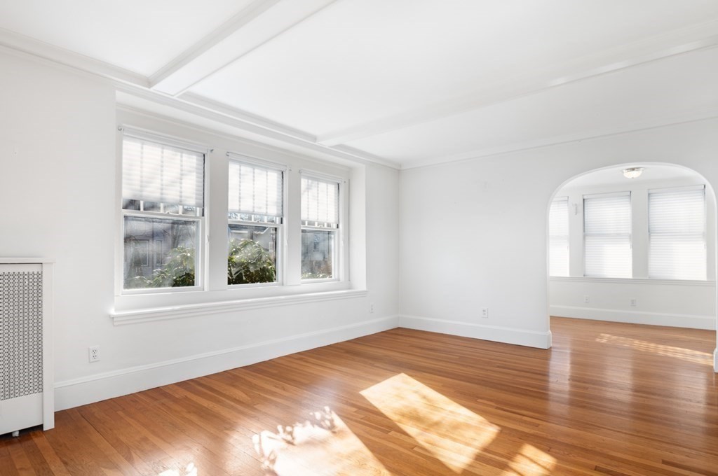 6 Stone Street Saugus, MA 01906 - Photo 17 of 39 an empty room with wooden floor and windows
