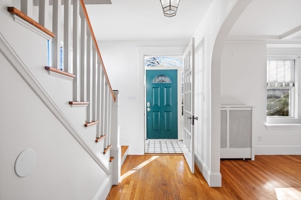 6 Stone Street Saugus, MA 01906 - Photo 19 of 39 a view of a livingroom with wooden floor and staircase