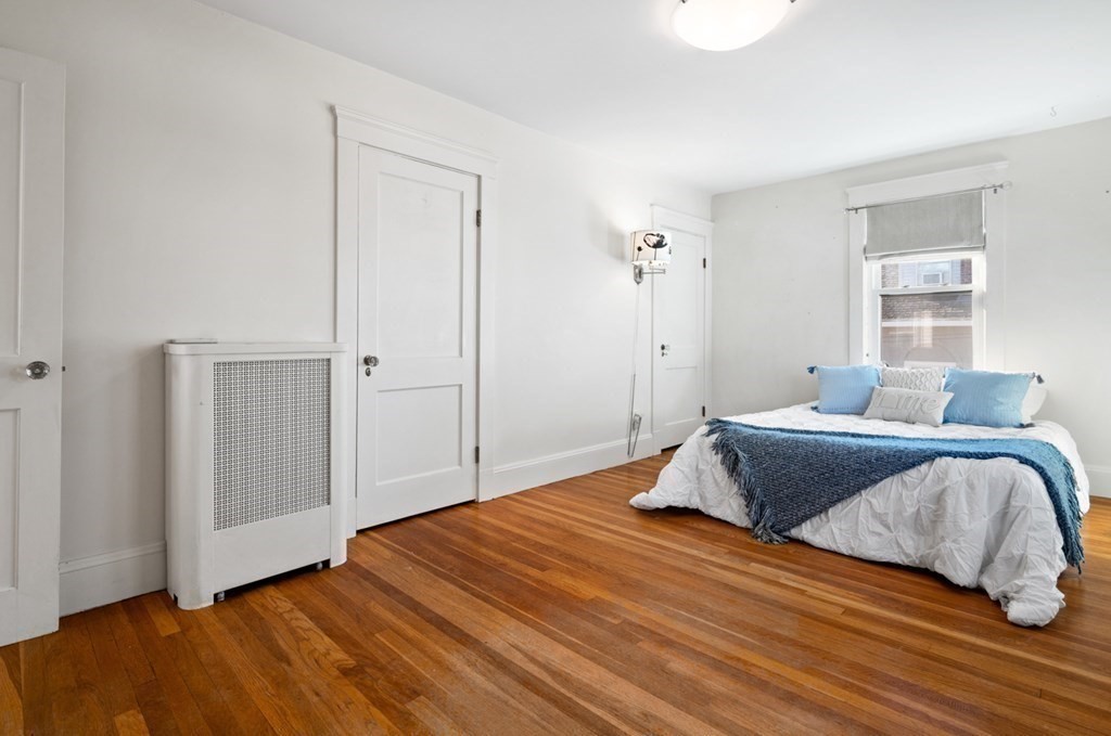 6 Stone Street Saugus, MA 01906 - Photo 23 of 39 a bedroom with a bed and wooden floor