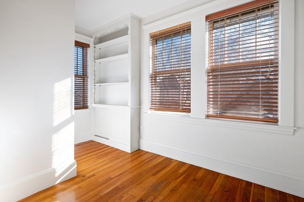 6 Stone Street Saugus, MA 01906 - Photo 26 of 39 a view of an empty room with wooden floor and a window