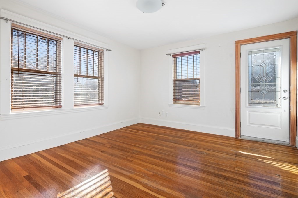 6 Stone Street Saugus, MA 01906 - Photo 28 of 39 a view of an empty room with wooden floor and a window