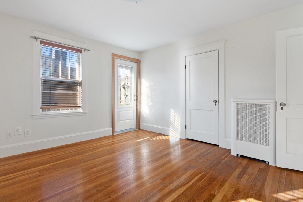 6 Stone Street Saugus, MA 01906 - Photo 29 of 39 a view of an empty room with wooden floor and a window