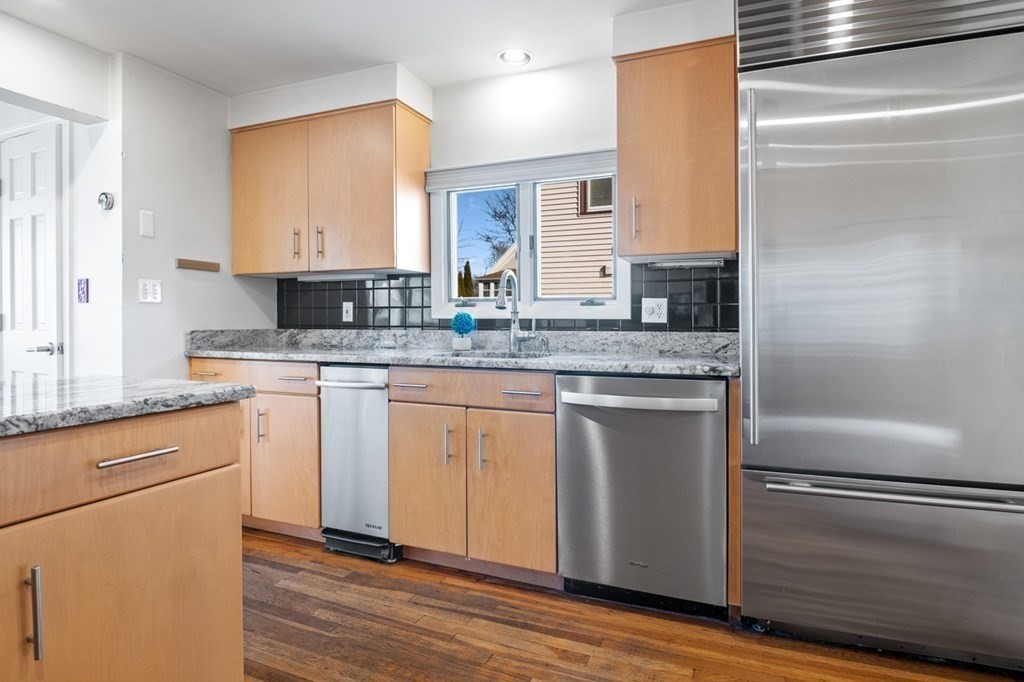 6 Stone Street Saugus, MA 01906 - Photo 4 of 39 a kitchen with a refrigerator sink and cabinets