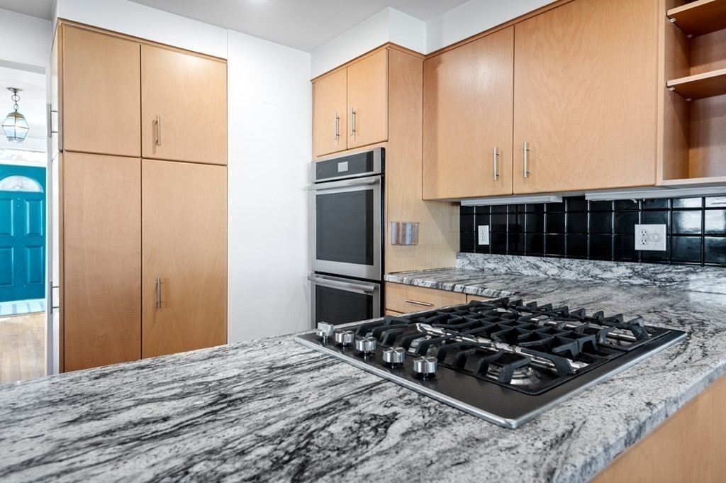 6 Stone Street Saugus, MA 01906 - Photo 6 of 39 a kitchen with a stove and a refrigerator