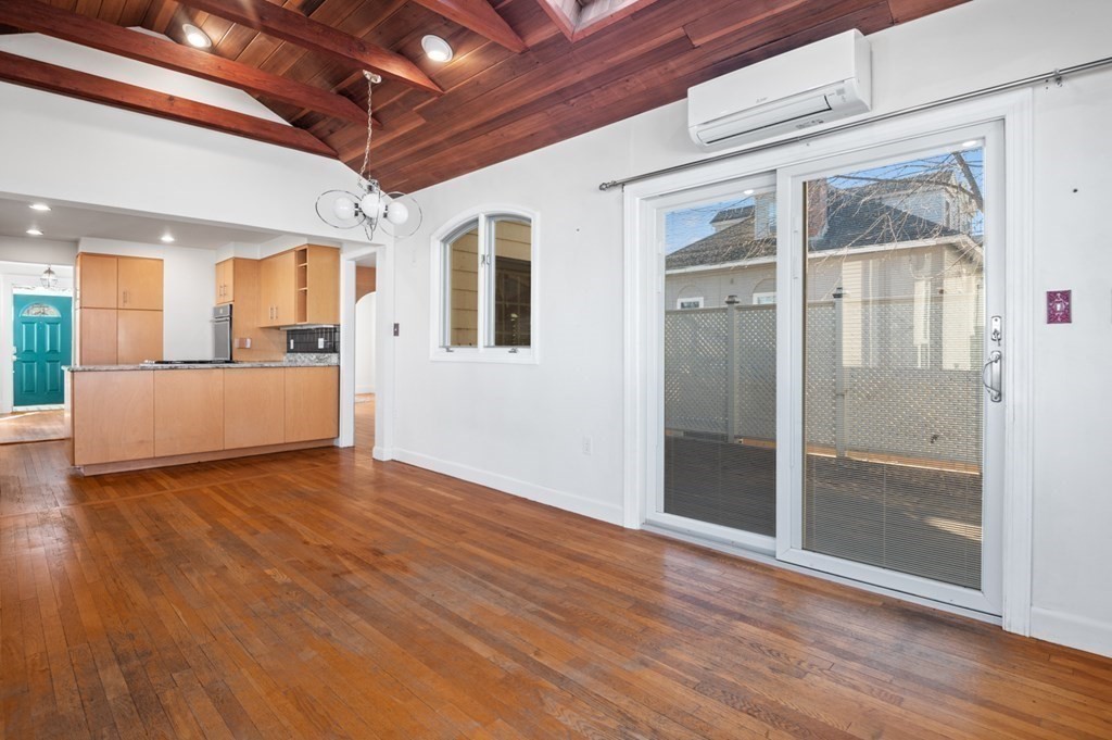 6 Stone Street Saugus, MA 01906 - Photo 9 of 39 a view of a livingroom with wooden floor and windows