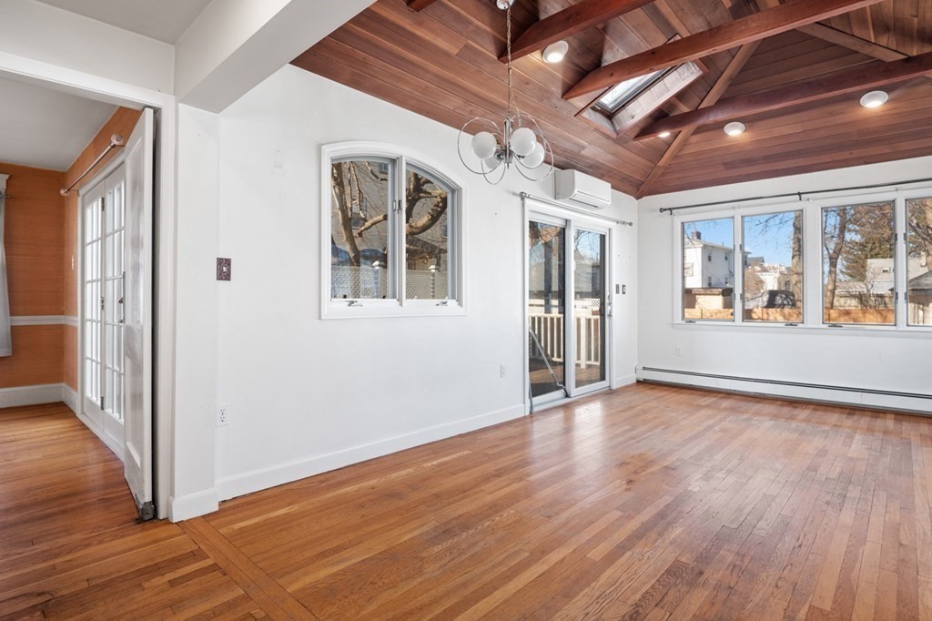 6 Stone Street Saugus, MA 01906 - Photo 10 of 39 a view of an empty room with wooden floor and a window