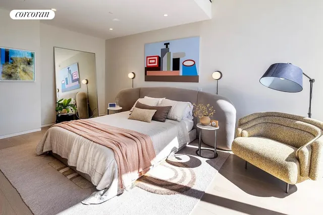 a bedroom with bed and a large window