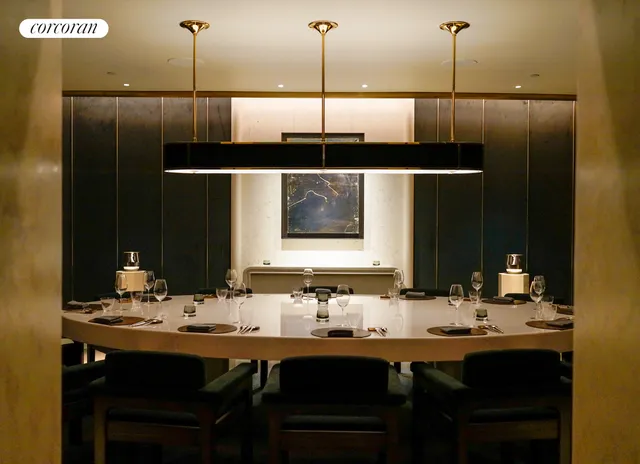 a view of an outdoor dining space with a table and chairs