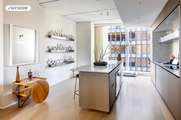 a kitchen with a table and chairs in it