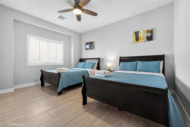 a bedroom with a bed and a desk