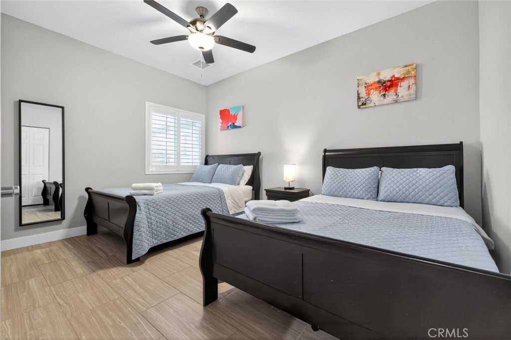 2120 West Nicola Road Palm Springs, CA 92262 - Photo 17 of 30 a bedroom with bed and wooden floor