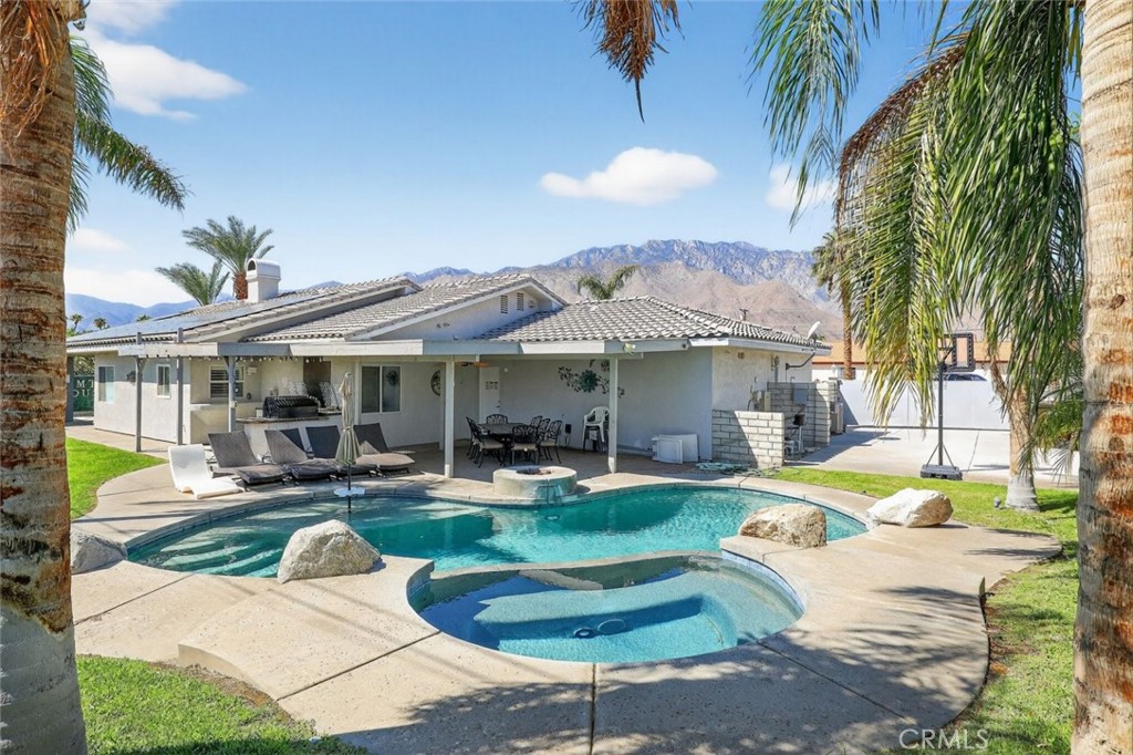 2120 West Nicola Road Palm Springs, CA 92262 - Photo 26 of 30 a view of a house with swimming pool and sitting area