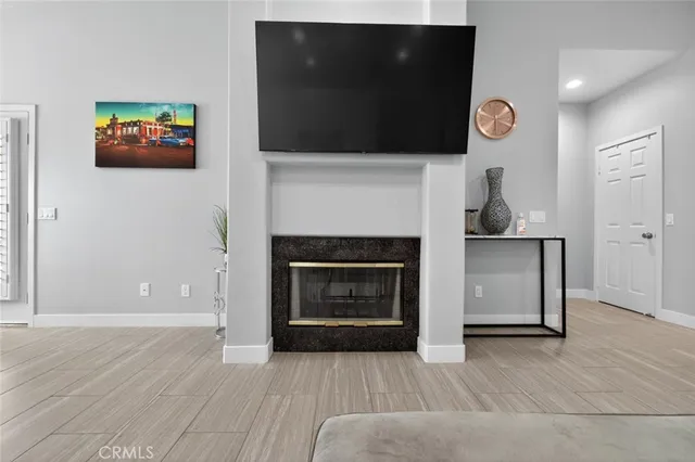 a living room with furniture and kitchen view