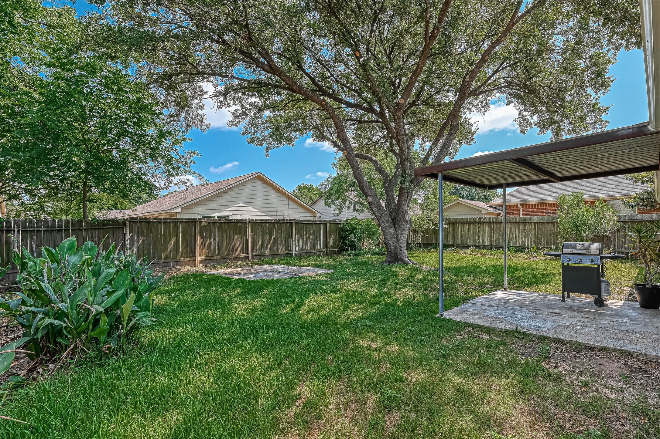 22622 John Rolfe Lane Katy, TX 77449 - Photo 19 of 21 a view of a house with yard and a garden