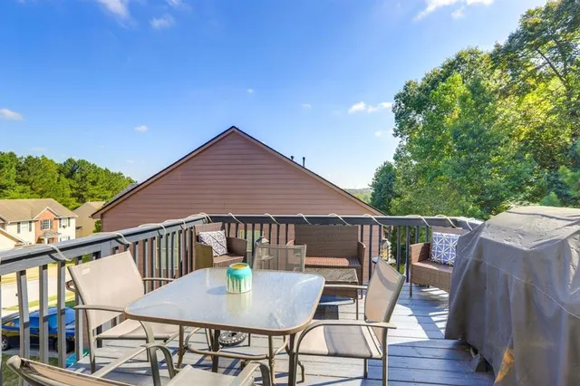 a view of balcony with table and chairs