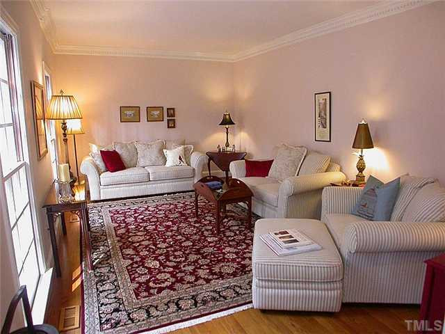 10769 Trego Trail Raleigh, NC 27614 - Photo 4 of 25 Spacious formal living room features custom moldings, hardwood floors and smooth 9' ceilings. Living Room