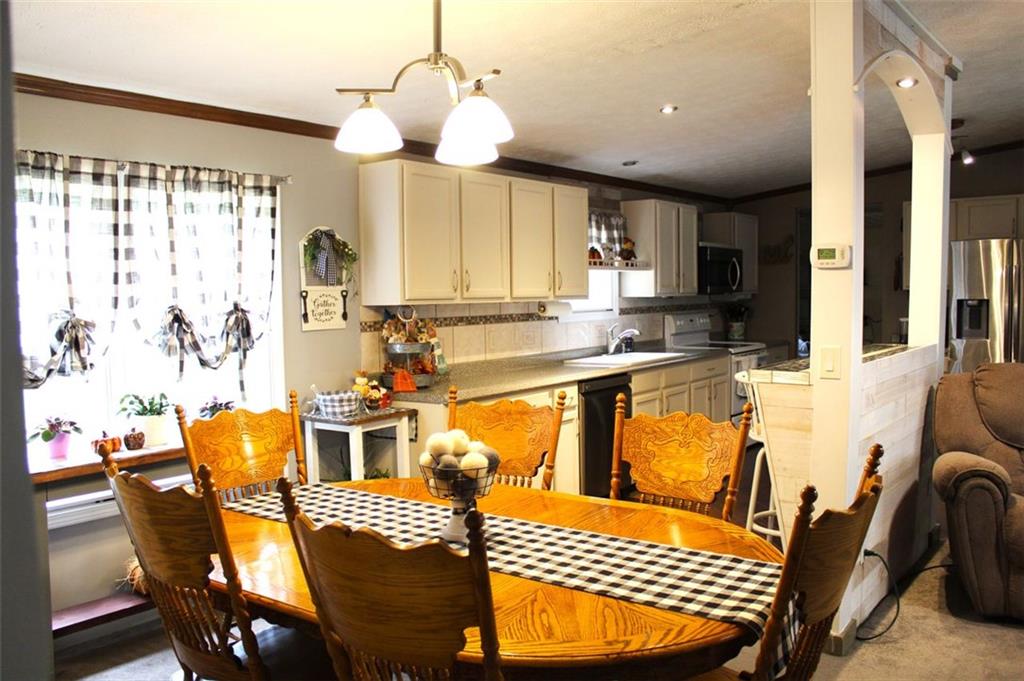 396 Old Harden Orchard Road Commerce, GA 30529 - Photo 8 of 21 a view of a dining room and livingroom with furniture