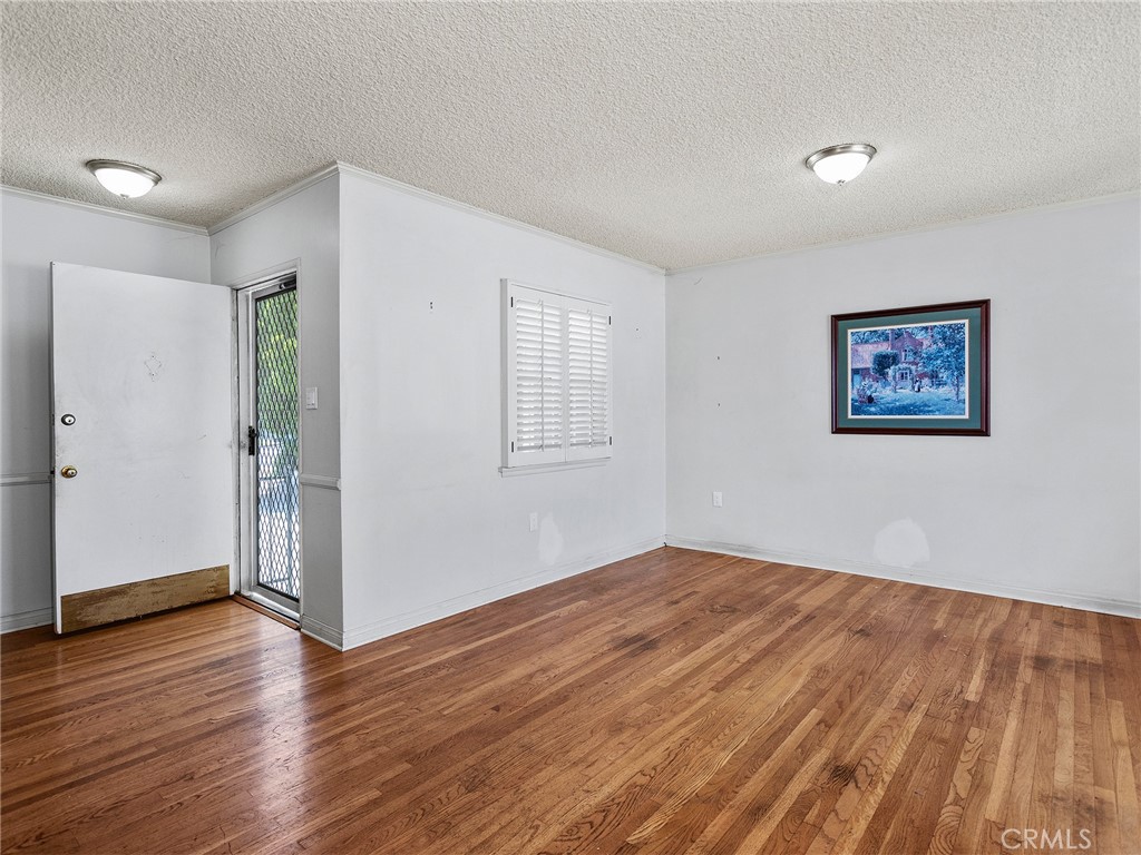 2724 Scott Road Burbank, CA 91504 - Photo 15 of 43 a view of empty room with wooden floor and fan