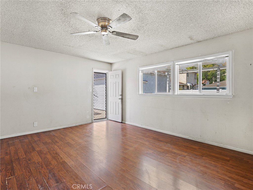 2724 Scott Road Burbank, CA 91504 - Photo 25 of 43 a view of an empty room with a window and wooden floor