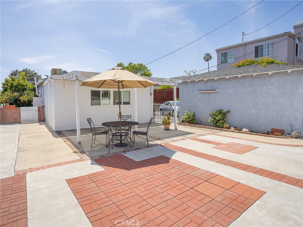 2724 Scott Road Burbank, CA 91504 - Photo 30 of 43 a outdoor space with furniture and umbrella