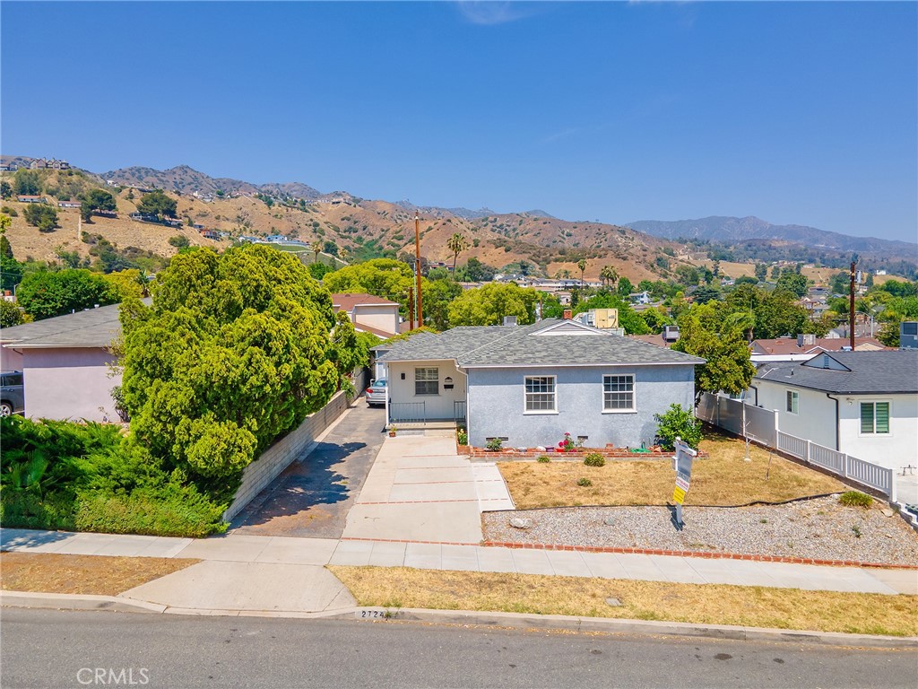 2724 Scott Road Burbank, CA 91504 - Photo 36 of 43 a front view of house with yard and mountain view in back