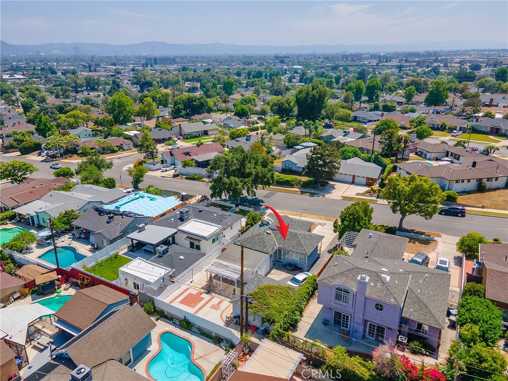 2724 Scott Road Burbank, CA 91504 - Photo 41 of 43 an aerial view of a city with lots of residential buildings and mountain view in back