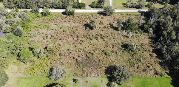 a view of a lake with a yard