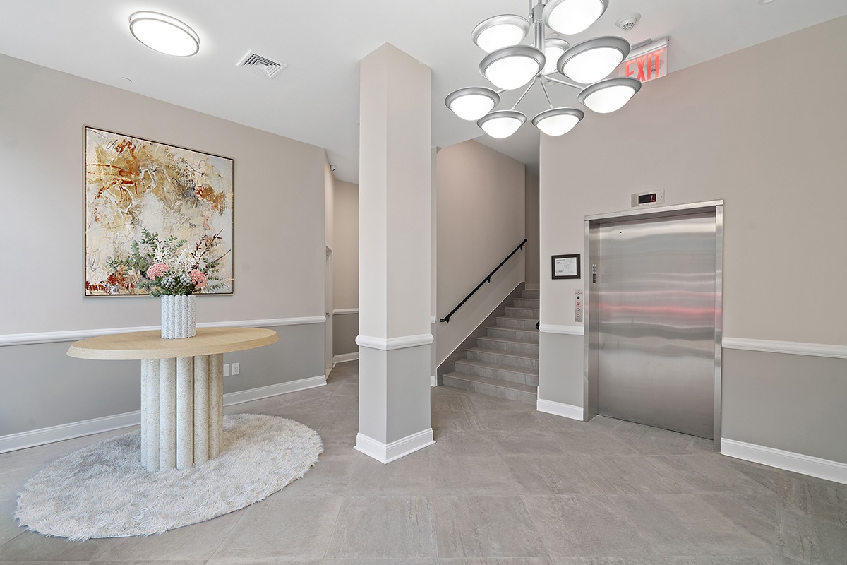 14-41 Broadway, Unit 6C Queens, NY 11106 - Photo 10 of 13 a view of entryway and chandelier