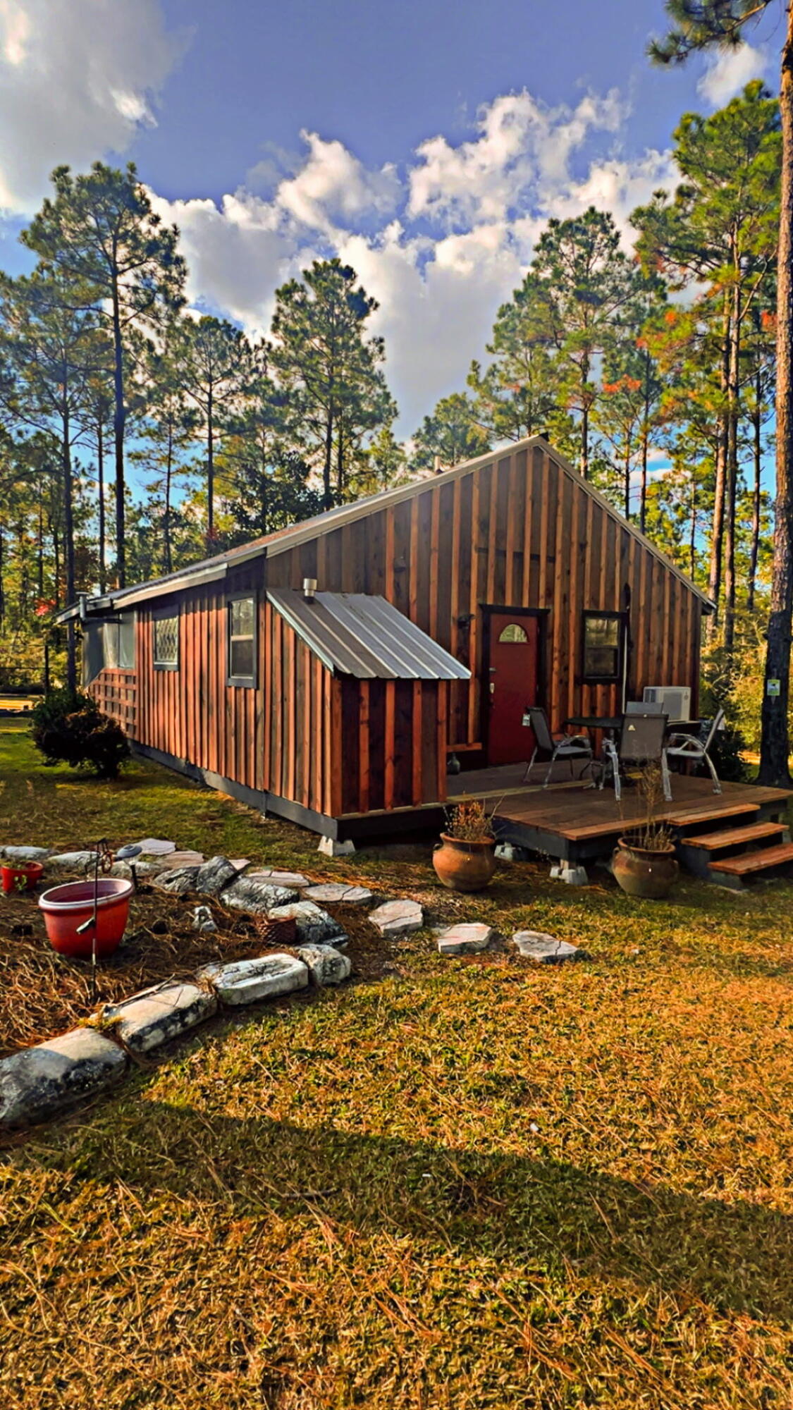 5 West A W Chapel Road Laurel Hill, FL 32567 - Photo 3 of 14 a view of a house with backyard and wooden fence
